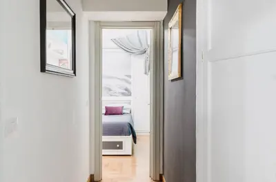 a hallway with a door leading to a bedroom at Suite Design Piazza di Spagna in Rome