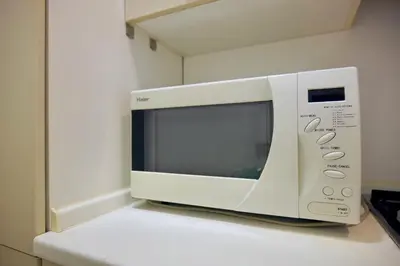 a microwave oven sitting on top of a kitchen counter at Fororomano Luxury in Rome
