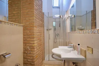 a bathroom with a sink and a shower at Fororomano Luxury in Rome