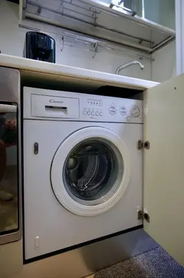 a white washer and dryer in a kitchen at Fororomano Luxury in Rome