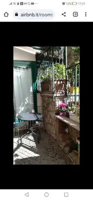 a table and chairs in front of a building at Il Giardino del Borgo in Rome