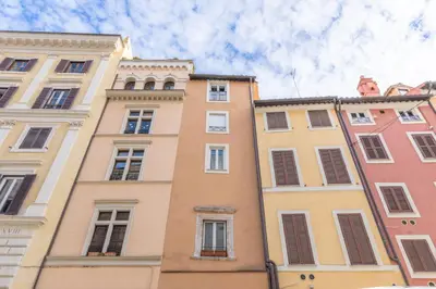 a row of tall buildings in a city at AC21 - Palazzetto Campo de' Fiori in Rome