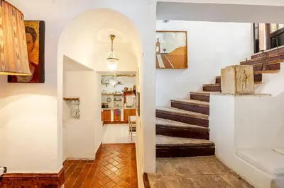 a hallway with a staircase in a house at Riad Riari in Rome