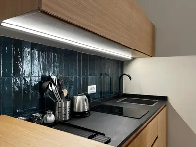 a kitchen with a sink and a counter top at Trastevere Suite apartment in Rome