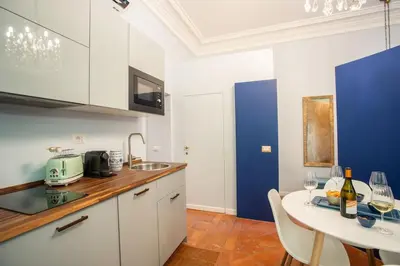 a bedroom with a bed with a mirror and a table at PgrHome Colosseo 11 BLU in Rome