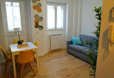 a living room with a couch and a table at Santo Apartment in Trastevere in Rome