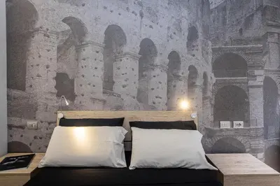a bedroom with a castle mural on the wall at San Pietro Guest House in Rome