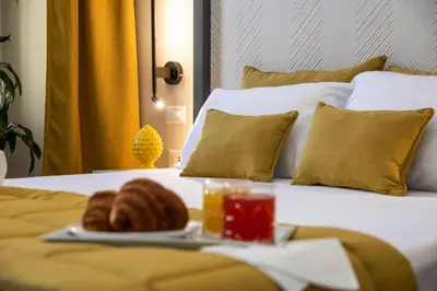 a tray with a plate of food on a bed at Trastevere 143 in Rome