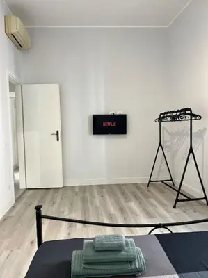 a white room with a sign on the wall at Campo de’ Fiori Rooftop Apartment in Rome
