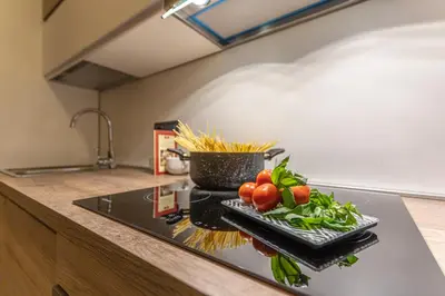 a kitchen counter with a tray of vegetables on it at Welcome to Pantheon in Rome