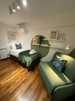 a hotel room with a bed and a couch at Welcome to Pantheon in Rome