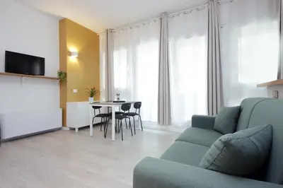 a living room with a couch and a table at Porta San Giovanni Suite in Rome