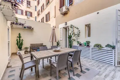 a bedroom with a bed and a mural of leaves at Nala Luxury Apartment with terrace in Rome