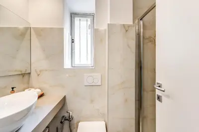 a bathroom with a sink and a shower at Nala Luxury Apartment with terrace in Rome