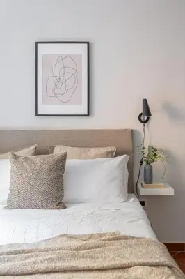 a white bedroom with a bed and a window at Dolce Vita Dreaming Studio in Rome