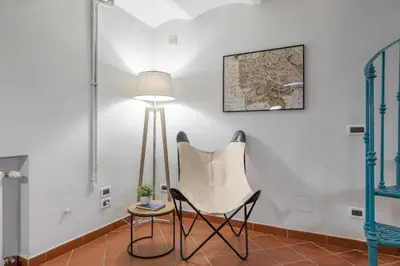 a bedroom with a bed with white sheets and pillows at Dolce Vita Dreaming Studio in Rome