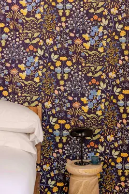 a bedroom with a blue and yellow floral wallpaper at TrastevereHome - Santa Maria della Quercia in Rome
