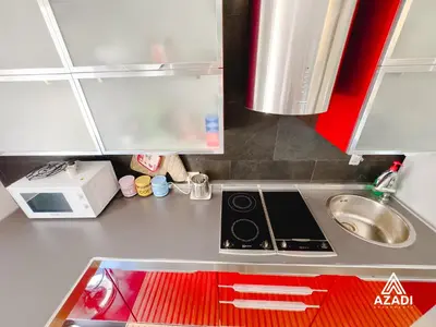 a small kitchen with a sink and a stove at Azadi Suite Flaminio in Rome