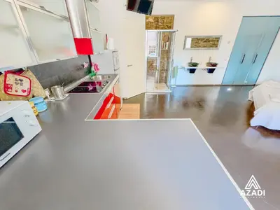 a kitchen with a stainless steel counter top at Azadi Suite Flaminio in Rome