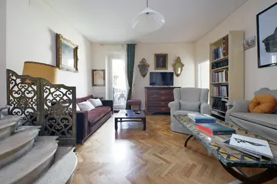 a living room with a couch and a table at On The Steps in Rome
