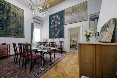 a dining room with a table and chairs at On The Steps in Rome