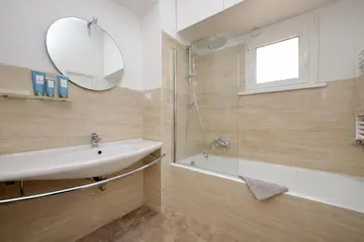 a bathroom with a sink and a shower at On The Steps in Rome