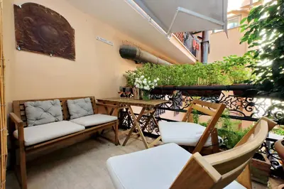 a patio with two chairs and a table and a table at On The Steps in Rome