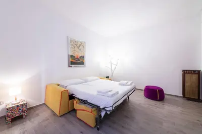 a bedroom with a bed in a room at Casa Riboty in Rome