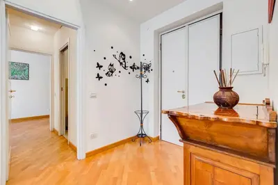 a room with a vase on top of a table at Crescenzio St Peter’s House in Rome