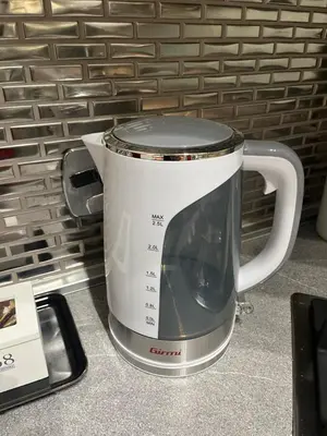a large white coffee mug sitting on a counter at Daag Corso Luxury Apartment in Rome