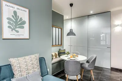 a living room with a table and chairs at Daag Corso Luxury Apartment in Rome