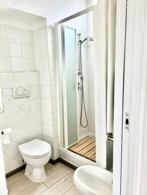 a bathroom with a toilet and a shower at Casa Fiore in Rome