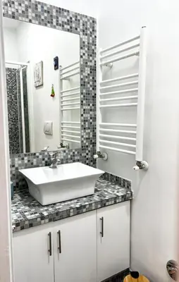 a bathroom with a sink and a mirror at Casa Fiore in Rome