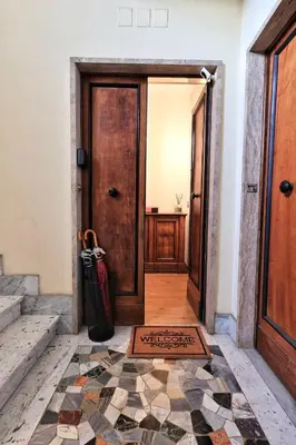a hallway with a door and a tile floor at Flaminio Luxury - GR HOME in Rome