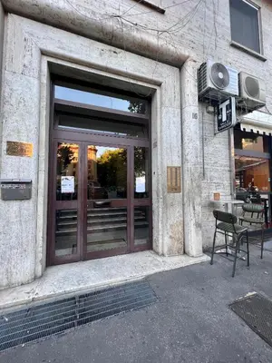a door of a building with a bench in front of it at Flaminio Luxury - GR HOME in Rome