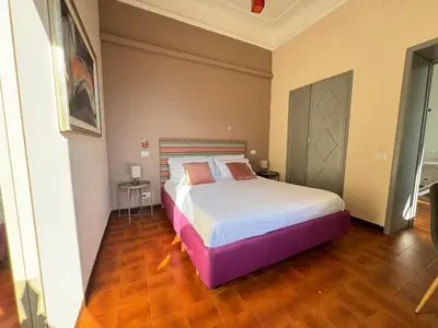 a bedroom with a large bed in a room at Upi-Up Rome Staying in Rome
