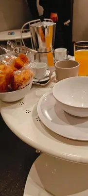 a table with plates and bowls of food on it at ROMAnce Cosimato Trastevere B&B in Rome