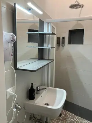 a bathroom with a sink and a toilet at The Green House in Rome