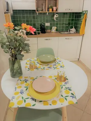 a table with plates on it in a kitchen at Nest to Colosseum in Rome