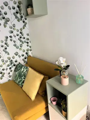 a living room with a couch and a side table at Nest to Colosseum in Rome