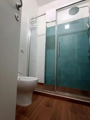 a bed with two towels on top of it at SAN PAOLO ROMA HOLIDAY HOME in Rome