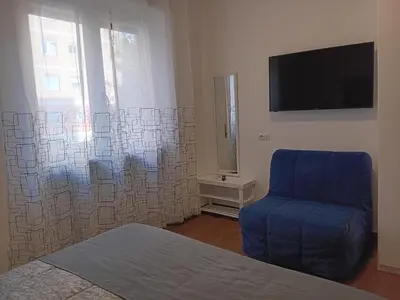 a living room with a couch and a table at SAN PAOLO ROMA HOLIDAY HOME in Rome
