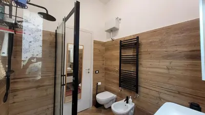 a bathroom with a toilet and a sink at casa vacanza vaticano in Rome