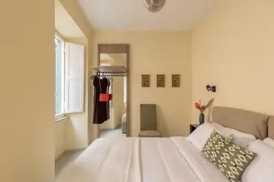 a bedroom with a bed and a window at iFlat Lovely in Trevi in Rome