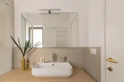 a bathroom with a white sink and a mirror at iFlat Lovely in Trevi in Rome