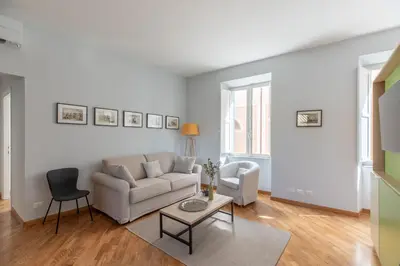 a living room with a couch and a table at iFlat Trevi Charming in Rome