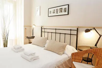 a bedroom with a white bed with towels on it at Apartment Felice in Rome