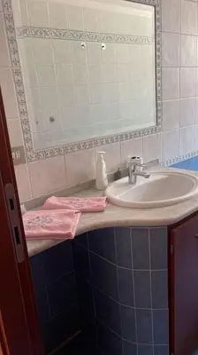 a bathroom with a sink and a mirror at Nice flat in Furio Camillo in Rome