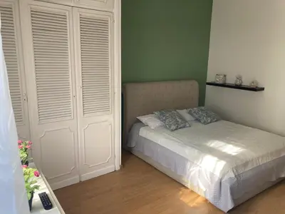 a bedroom with a bed and two white doors at Terrace! in Rome