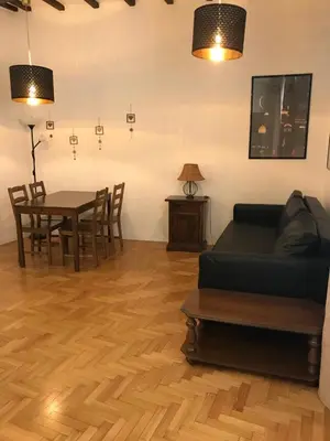 a living room with a couch and a table at Casa Magiuli' Navona in Rome